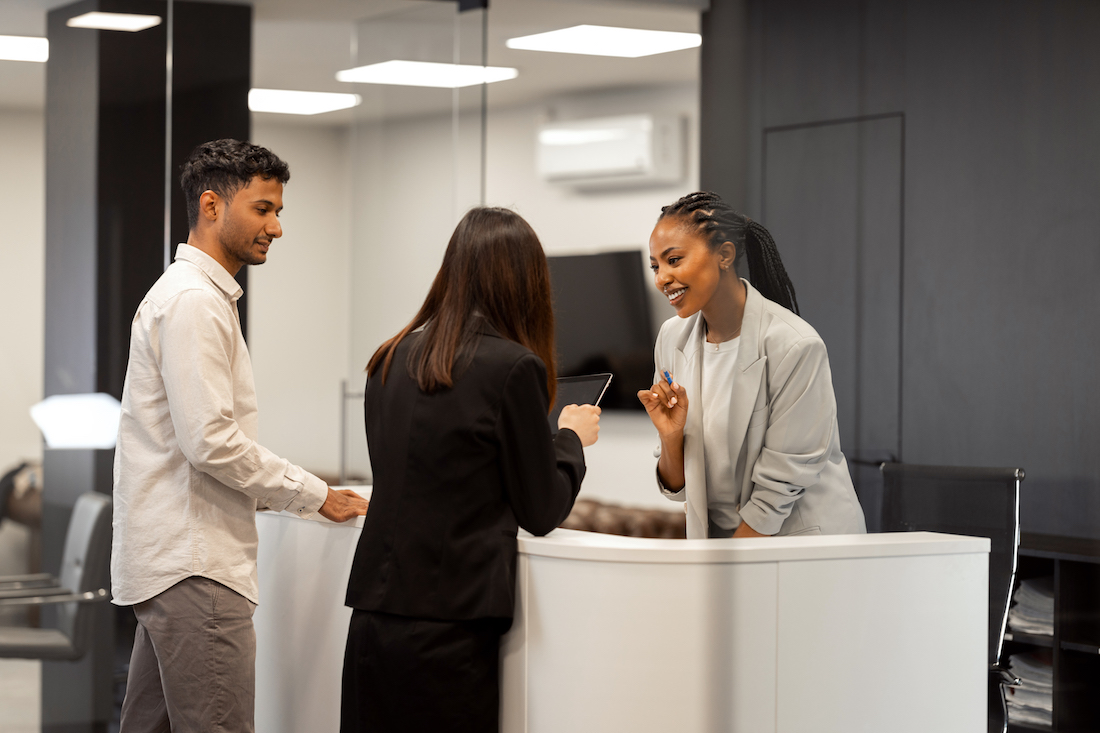 Receptionist helping new customers