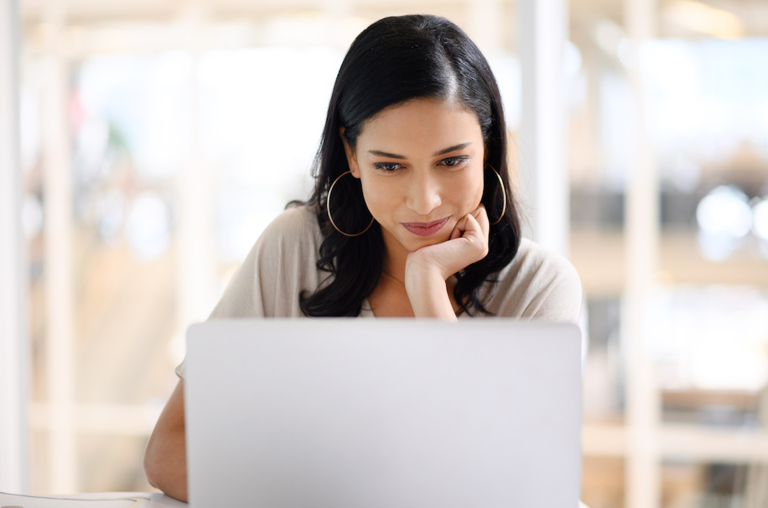 Woman searching website content for information to purchase from business